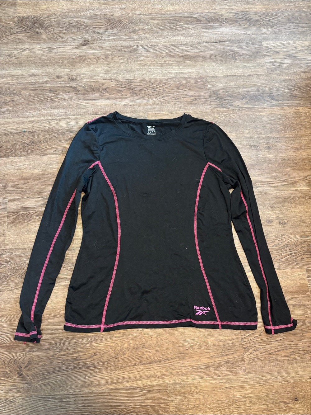 women’s black and pink long sleeve reebok top